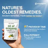Nature's oldest remedies — a hand holding the Pure Oregano pouch against a bright sky